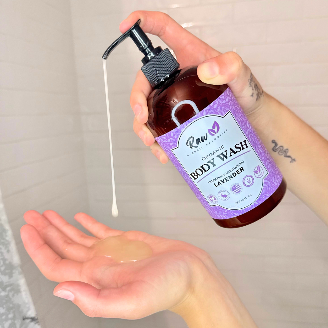 A woman pouring organic lavender body wash onto her hands. This natural, hydrating, and moisturizing body wash is perfect for women, featuring a pump bottle for easy use. Gentle on sensitive skin, made with all-natural ingredients like shea butter and coconut, and offering a soothing lavender scent.