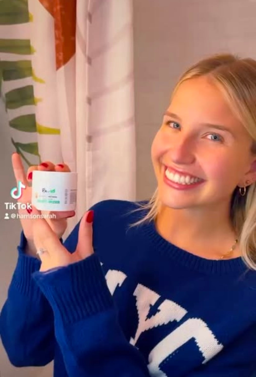 Young woman with flawless skin applying Raw Organic Cosmetics organic retinol face cream, showcasing its ability to enhance skin texture and promote a radiant complexion.